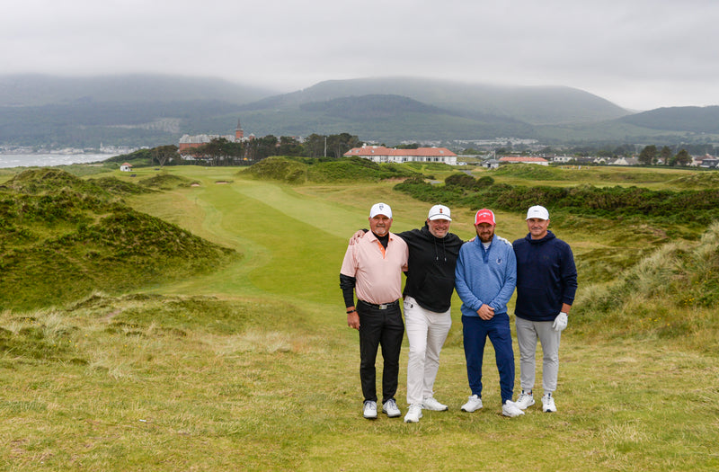 Golfers on an Ireland buddies golf vacation trip at the famous ninth hole at Royal County Down.